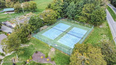 CHARMING UPGRADED POCONOS CHALET Completely Updated 3BR 2.5BA on Pocono Farms Country Club in Pennsylvania - for sale on GolfHomes.com, golf home, golf lot