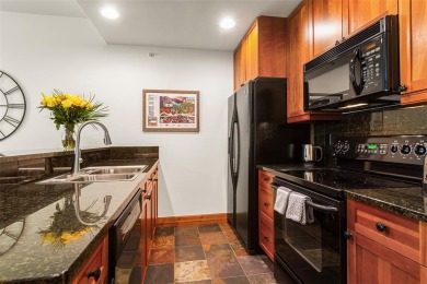 Tucked within a serene enclave of mature Aspens and beautifully on Breckenridge Golf Club in Colorado - for sale on GolfHomes.com, golf home, golf lot