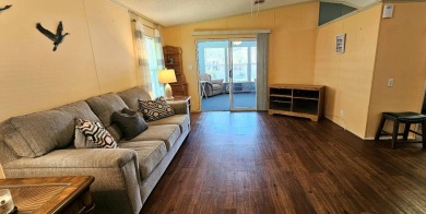 Furnished, spacious 2 bedroom 2 bath home in 55 + Resort style on Zephyrhills Municipal Golf Course in Florida - for sale on GolfHomes.com, golf home, golf lot