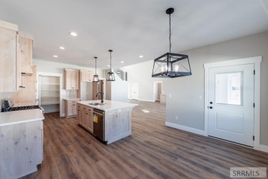 Situated on 0.29 acres, its brand-new faade exudes modern on Sage Lakes Municipal Golf Course in Idaho - for sale on GolfHomes.com, golf home, golf lot