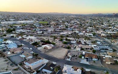 This beautifully prepped lot on War Eagle Dr has been graded on London Bridge Golf Course in Arizona - for sale on GolfHomes.com, golf home, golf lot
