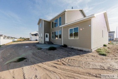 Situated on 0.29 acres, its brand-new faade exudes modern on Sage Lakes Municipal Golf Course in Idaho - for sale on GolfHomes.com, golf home, golf lot