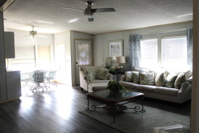 This charming, fully furnished 2-bedroom home sits in a friendly on Schalamar Creek Golf and Country Club in Florida - for sale on GolfHomes.com, golf home, golf lot