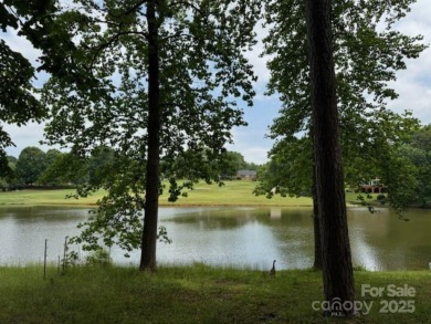 A wonderful golf lot next to the green and overlooking the lake on Cherryville Golf and  Country Club in North Carolina - for sale on GolfHomes.com, golf home, golf lot