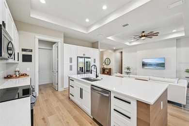 Sunsets, pond and golf course views become part of everyday life on Pinemoor West Golf Club in Florida - for sale on GolfHomes.com, golf home, golf lot