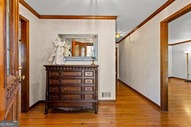 Tucked into the heart of Peachtree City, this home has been on Canongate At Flat Creek Club in Georgia - for sale on GolfHomes.com, golf home, golf lot