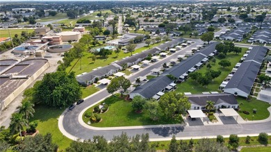Welcome to this light-filled 2-bedroom, 2-bath end-unit villa in on Myerlee Country Club in Florida - for sale on GolfHomes.com, golf home, golf lot