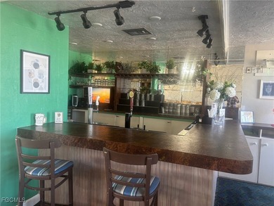 Welcome to this light-filled 2-bedroom, 2-bath end-unit villa in on Myerlee Country Club in Florida - for sale on GolfHomes.com, golf home, golf lot