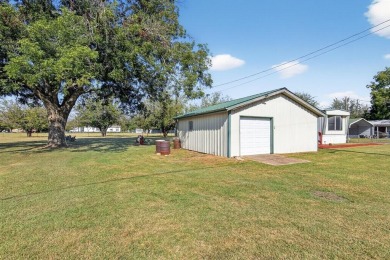 Video walk through available on YouTube! Singlewide on 3 lots on Horseshoe Bend Country Club in Texas - for sale on GolfHomes.com, golf home, golf lot