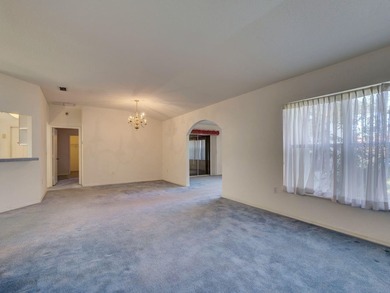 One or more photo(s) has been virtually staged. Live the Florida on Royal Oaks Golf Club in Florida - for sale on GolfHomes.com, golf home, golf lot