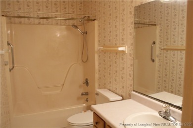 Welcome to this 2-bedroom, 2-bathroom townhome located right on on Kings Grant Golf and Country Club in North Carolina - for sale on GolfHomes.com, golf home, golf lot
