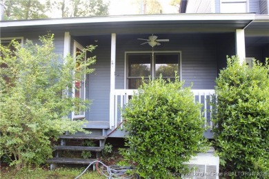 Welcome to this 2-bedroom, 2-bathroom townhome located right on on Kings Grant Golf and Country Club in North Carolina - for sale on GolfHomes.com, golf home, golf lot