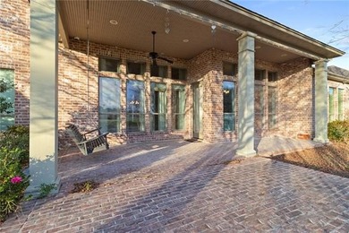 Enjoy serene water and golf course views from this exceptional on Oak Harbor Golf Club in Louisiana - for sale on GolfHomes.com, golf home, golf lot