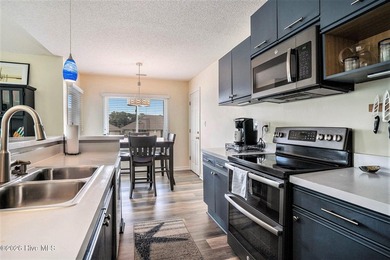 Welcome to 815 Colony Drive, Unit F, in beautiful Sunset Beach on Sea Trail Golf Resort in North Carolina - for sale on GolfHomes.com, golf home, golf lot