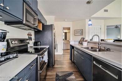 Welcome to 815 Colony Drive, Unit F, in beautiful Sunset Beach on Sea Trail Golf Resort in North Carolina - for sale on GolfHomes.com, golf home, golf lot