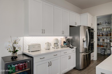 Indulge in refined luxury in this extraordinary Toll Brothers on Sterling Grove Golf & Country Club in Arizona - for sale on GolfHomes.com, golf home, golf lot