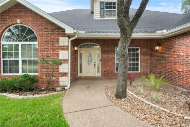 Tucked away in the Rockport Country Club, under the shade of oak on Rockport Country Club in Texas - for sale on GolfHomes.com, golf home, golf lot