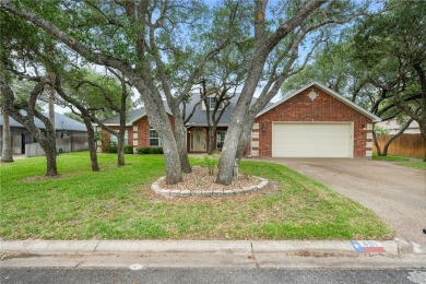 Tucked away in the Rockport Country Club, under the shade of oak on Rockport Country Club in Texas - for sale on GolfHomes.com, golf home, golf lot