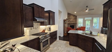 Discover the epitome of upscale living in this meticulously on Tellico Village -The Links At Kahite Golf Course in Tennessee - for sale on GolfHomes.com, golf home, golf lot