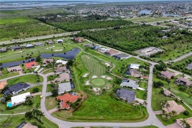 Nestled in the heart of Cape Coral, this extraordinary property on Royal Tee Country Club in Florida - for sale on GolfHomes.com, golf home, golf lot