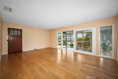 Step into this beautifully reimagined upstairs corner unit in on Leisure World Seal Beach Golf Course in California - for sale on GolfHomes.com, golf home, golf lot