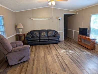 Enjoy a reasonably priced lake home in popular Arrowhead Estates on Arrowhead State Park Golf Course in Oklahoma - for sale on GolfHomes.com, golf home, golf lot