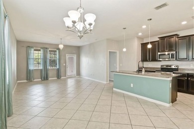 Welcome to this stunning 5-bedroom, 3.5-bath home with a on Harmony Golf Preserve in Florida - for sale on GolfHomes.com, golf home, golf lot