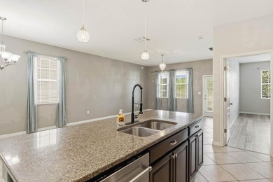 Welcome to this stunning 5-bedroom, 3.5-bath home with a on Harmony Golf Preserve in Florida - for sale on GolfHomes.com, golf home, golf lot