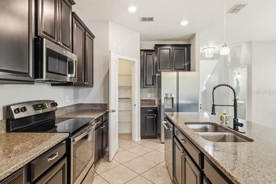 Welcome to this stunning 5-bedroom, 3.5-bath home with a on Harmony Golf Preserve in Florida - for sale on GolfHomes.com, golf home, golf lot