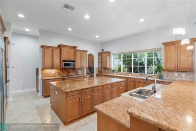 Stunning HOME in prestigious Edgewood at Heron Bay! This on Heron Bay Golf Club in Florida - for sale on GolfHomes.com, golf home, golf lot
