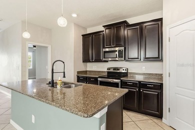 Welcome to this stunning 5-bedroom, 3.5-bath home with a on Harmony Golf Preserve in Florida - for sale on GolfHomes.com, golf home, golf lot