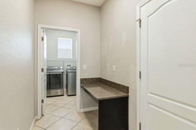 Welcome to this stunning 5-bedroom, 3.5-bath home with a on Harmony Golf Preserve in Florida - for sale on GolfHomes.com, golf home, golf lot