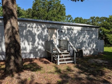 Enjoy a reasonably priced lake home in popular Arrowhead Estates on Arrowhead State Park Golf Course in Oklahoma - for sale on GolfHomes.com, golf home, golf lot