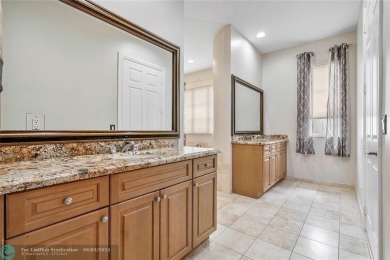 Stunning HOME in prestigious Edgewood at Heron Bay! This on Heron Bay Golf Club in Florida - for sale on GolfHomes.com, golf home, golf lot