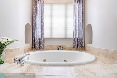 Stunning HOME in prestigious Edgewood at Heron Bay! This on Heron Bay Golf Club in Florida - for sale on GolfHomes.com, golf home, golf lot
