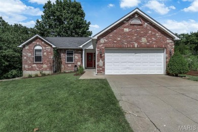 Welcome to your dream home in the exclusive, gated Raintree on Raintree Country Club in Missouri - for sale on GolfHomes.com, golf home, golf lot
