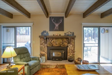 Surrounded by tall pines, this fully-furnished lower-level condo on Pinetop Lakes Golf and Country Club in Arizona - for sale on GolfHomes.com, golf home, golf lot