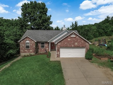 Welcome to your dream home in the exclusive, gated Raintree on Raintree Country Club in Missouri - for sale on GolfHomes.com, golf home, golf lot