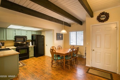 Surrounded by tall pines, this fully-furnished lower-level condo on Pinetop Lakes Golf and Country Club in Arizona - for sale on GolfHomes.com, golf home, golf lot