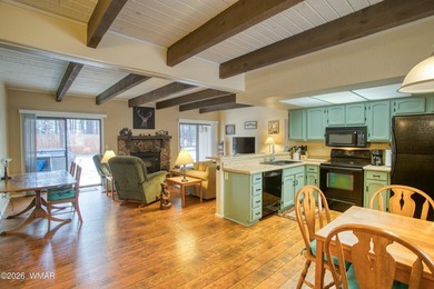 Surrounded by tall pines, this fully-furnished lower-level condo on Pinetop Lakes Golf and Country Club in Arizona - for sale on GolfHomes.com, golf home, golf lot