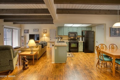 Surrounded by tall pines, this fully-furnished lower-level condo on Pinetop Lakes Golf and Country Club in Arizona - for sale on GolfHomes.com, golf home, golf lot