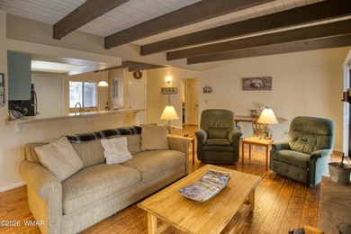 Surrounded by tall pines, this fully-furnished lower-level condo on Pinetop Lakes Golf and Country Club in Arizona - for sale on GolfHomes.com, golf home, golf lot