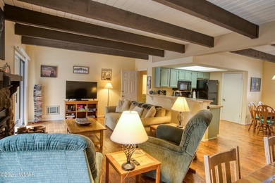 Surrounded by tall pines, this fully-furnished lower-level condo on Pinetop Lakes Golf and Country Club in Arizona - for sale on GolfHomes.com, golf home, golf lot