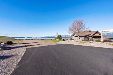 Enjoy breathtaking views of Flathead Lake and the iconic Mission on Polson Bay Golf Course - Championship Course in Montana - for sale on GolfHomes.com, golf home, golf lot
