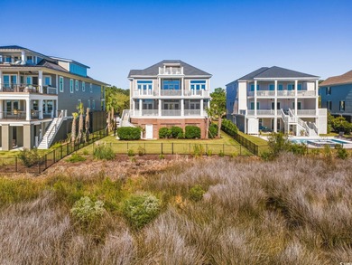 Enjoy breathtaking panoramic views of the marsh, estuary, and on DeBordieu Country Club in South Carolina - for sale on GolfHomes.com, golf home, golf lot