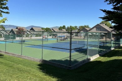 Enjoy breathtaking views of Flathead Lake and the iconic Mission on Polson Bay Golf Course - Championship Course in Montana - for sale on GolfHomes.com, golf home, golf lot