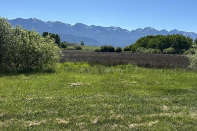 Enjoy breathtaking views of Flathead Lake and the iconic Mission on Polson Bay Golf Course - Championship Course in Montana - for sale on GolfHomes.com, golf home, golf lot