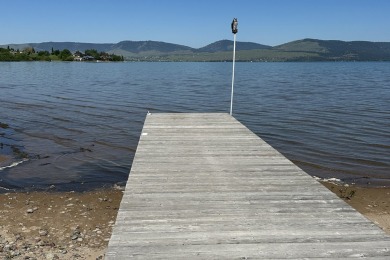 Enjoy breathtaking views of Flathead Lake and the iconic Mission on Polson Bay Golf Course - Championship Course in Montana - for sale on GolfHomes.com, golf home, golf lot