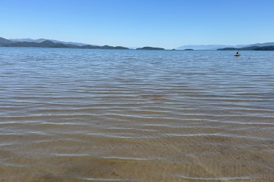 Enjoy breathtaking views of Flathead Lake and the iconic Mission on Polson Bay Golf Course - Championship Course in Montana - for sale on GolfHomes.com, golf home, golf lot