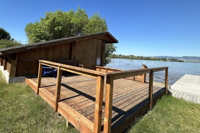 Enjoy breathtaking views of Flathead Lake and the iconic Mission on Polson Bay Golf Course - Championship Course in Montana - for sale on GolfHomes.com, golf home, golf lot